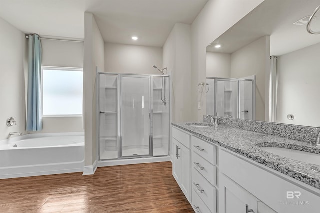 24774 Smarty Jones Cir, Daphne, AL 36526 - bathroom featuring a shower stall, double vanity, wood finished floors, a garden tub, and recessed lighting