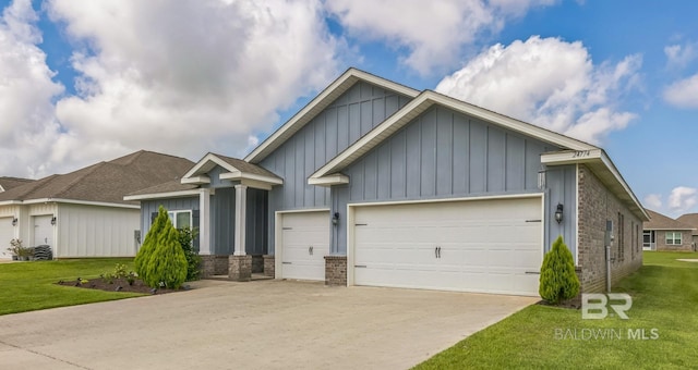 24774 Smarty Jones Cir, Daphne, AL 36526 - view of front of home with board and batten siding, an attached garage, driveway, and a front yard