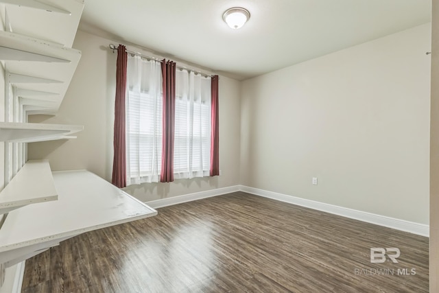 24774 Smarty Jones Cir, Daphne, AL 36526 - unfurnished living room featuring baseboards and dark wood-style floors