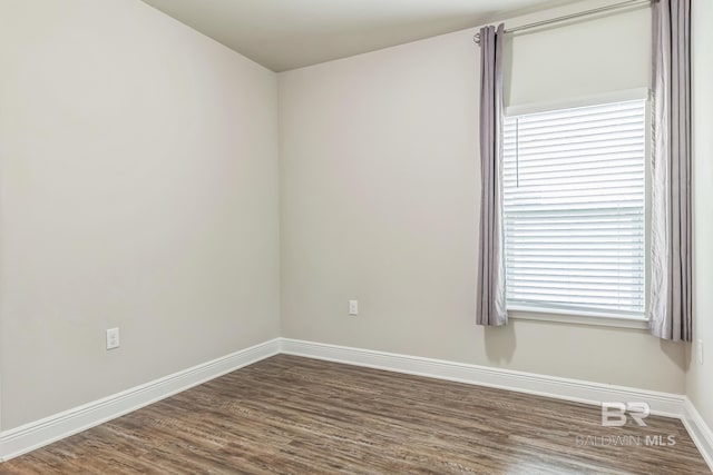 24774 Smarty Jones Cir, Daphne, AL 36526 - empty room with dark wood finished floors and baseboards