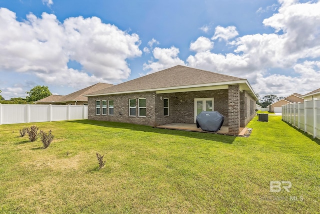 24774 Smarty Jones Cir, Daphne, AL 36526 - back of house featuring central AC unit, brick siding, a patio area, and a shingled roof