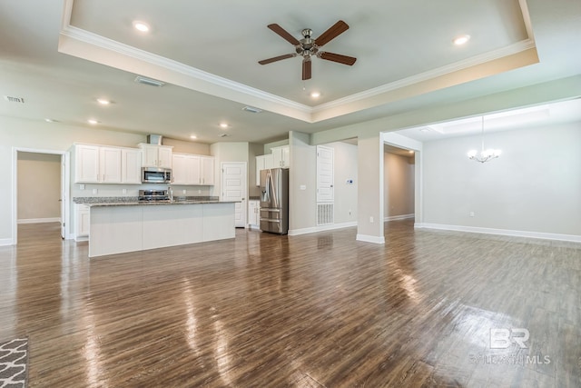 24774 Smarty Jones Cir, Daphne, AL 36526 - unfurnished living room featuring a tray ceiling, a chandelier, baseboards, ceiling fan, and ornamental molding