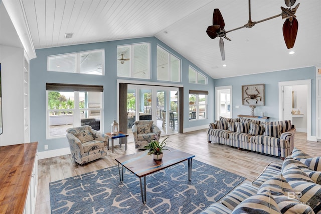 living room with high vaulted ceiling, french doors, ceiling fan, and hardwood / wood-style flooring