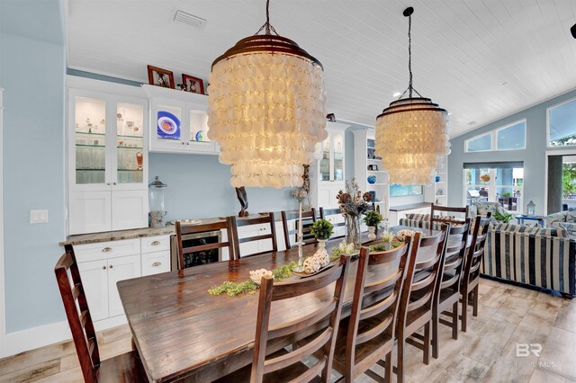 dining area featuring lofted ceiling