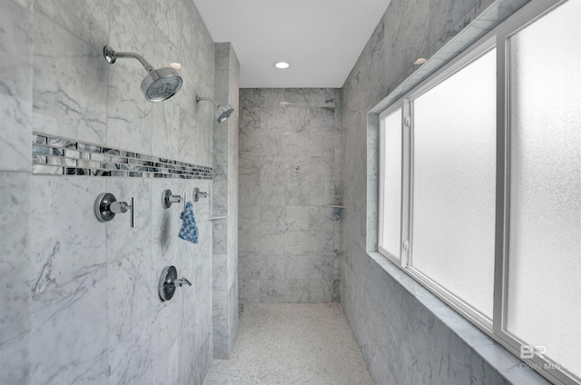 bathroom featuring a tile shower