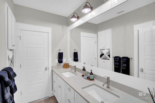 bathroom with dual vanity