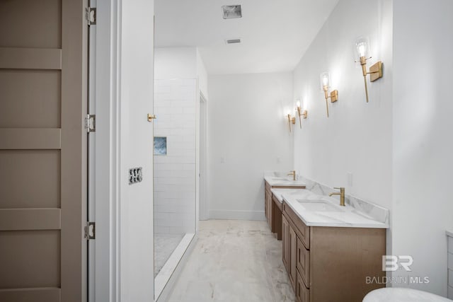 bathroom featuring vanity and a tile shower