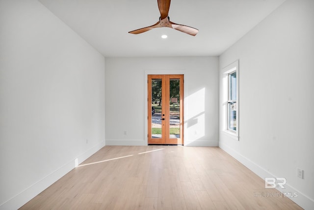 unfurnished room with light hardwood / wood-style flooring, french doors, and ceiling fan