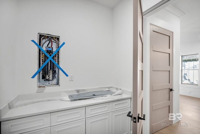 bathroom with vanity and hardwood / wood-style flooring