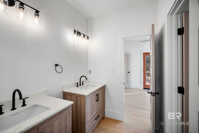 bathroom featuring vanity and hardwood / wood-style flooring