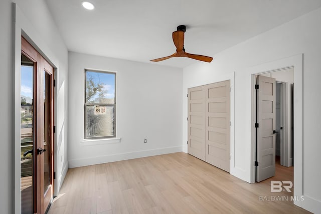 unfurnished bedroom featuring ceiling fan and light hardwood / wood-style flooring