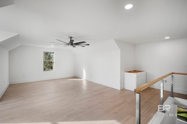 bonus room featuring vaulted ceiling, light hardwood / wood-style flooring, and ceiling fan