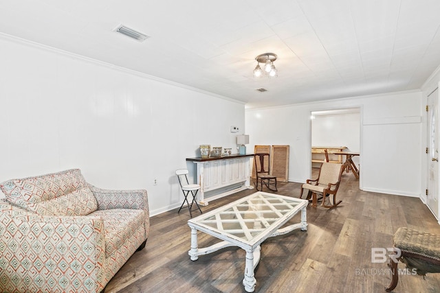 living area featuring crown molding and wood-type flooring