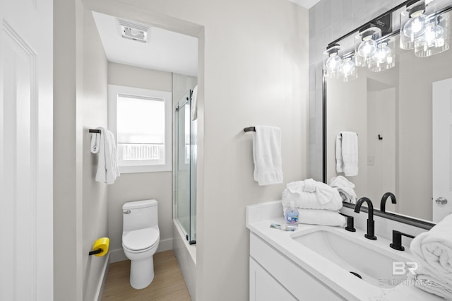 bathroom featuring visible vents, vanity, and toilet