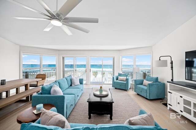 living area featuring ceiling fan and light wood finished floors