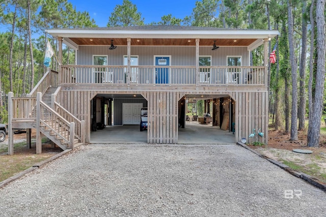 227 Conde Ave, Dauphin Island, AL 36528 - view of front of home with a carport, ceiling fan, stairs, and a porch