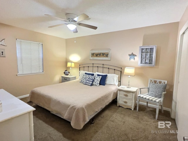 bedroom featuring a ceiling fan, carpet flooring, and baseboards