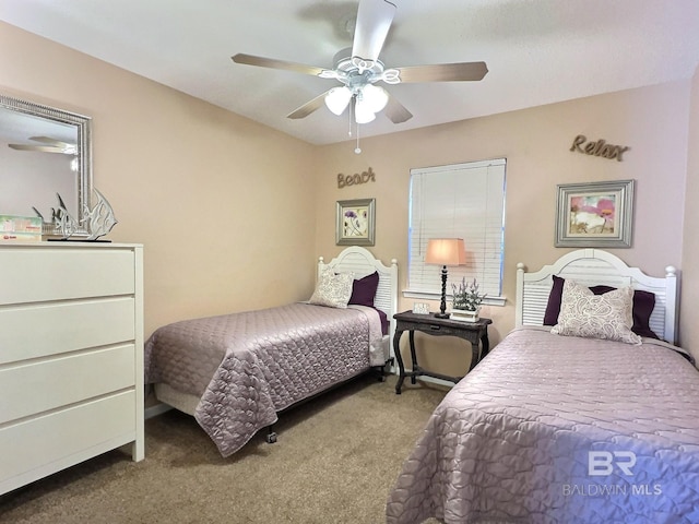 bedroom featuring ceiling fan and carpet floors