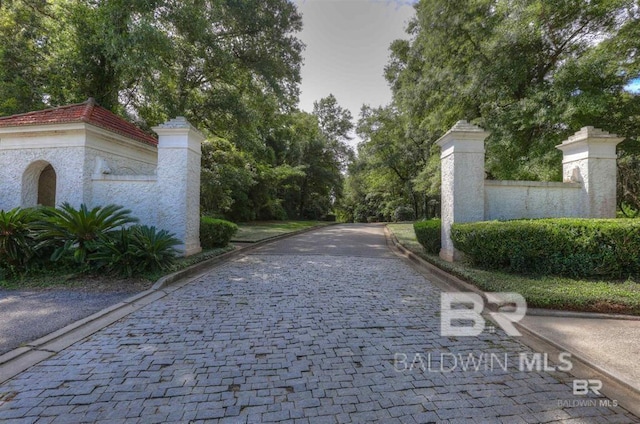 32 Viale Bellezza, Fairhope, AL 36532 - view of community featuring view of wooded area