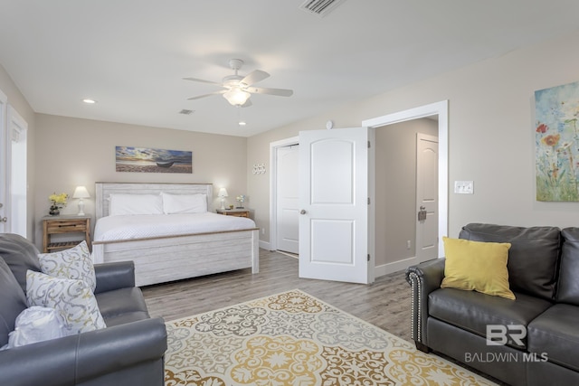 bedroom with visible vents, baseboards, wood finished floors, recessed lighting, and a ceiling fan