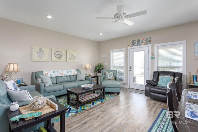 living area featuring ceiling fan, wood finished floors, and recessed lighting
