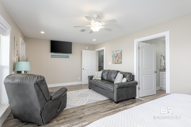 living room featuring recessed lighting, baseboards, ceiling fan, visible vents, and wood finished floors