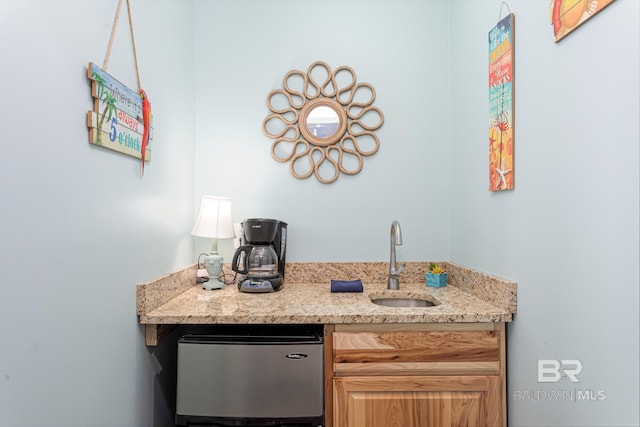 bar with a sink and indoor wet bar