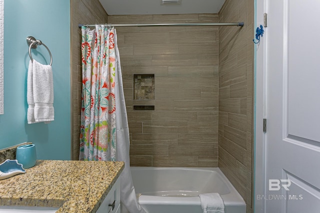 full bathroom featuring shower / tub combo with curtain and vanity