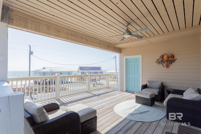 wooden terrace with a ceiling fan