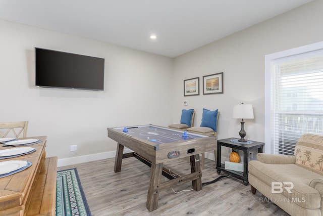 playroom with baseboards, light wood-style floors, and recessed lighting