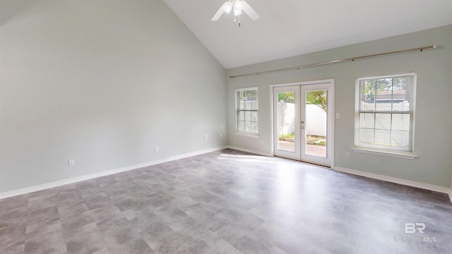 unfurnished room with high vaulted ceiling, ceiling fan, baseboards, and french doors