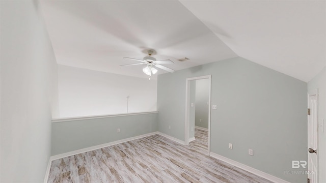 bonus room featuring visible vents, a ceiling fan, baseboards, light wood-type flooring, and vaulted ceiling