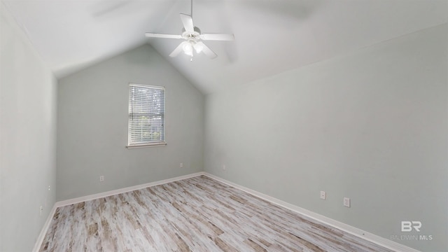bonus room featuring a ceiling fan, baseboards, lofted ceiling, and light wood finished floors