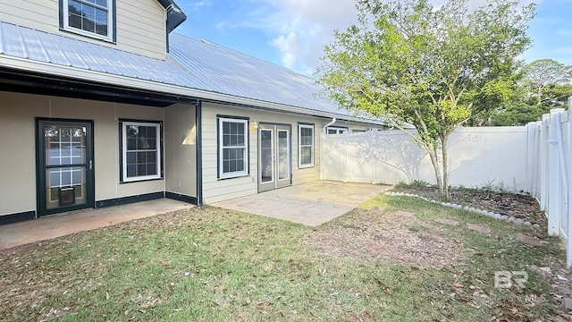 view of yard with a patio and a fenced backyard