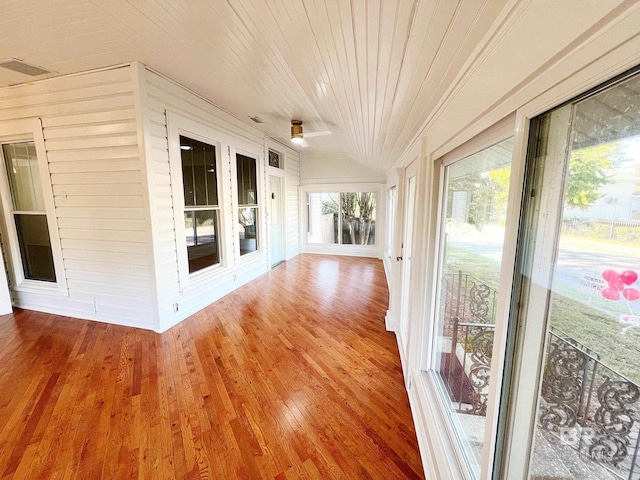 unfurnished sunroom with wooden ceiling and vaulted ceiling