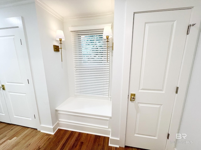 mudroom with ornamental molding and hardwood / wood-style floors