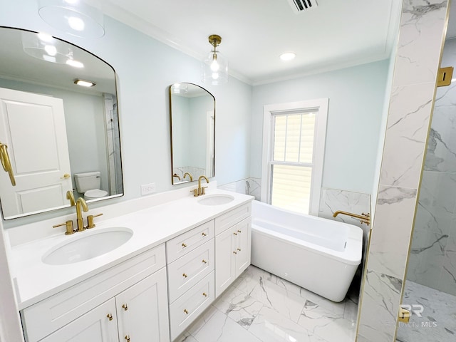 bathroom featuring a freestanding bath, marble finish floor, ornamental molding, and a sink