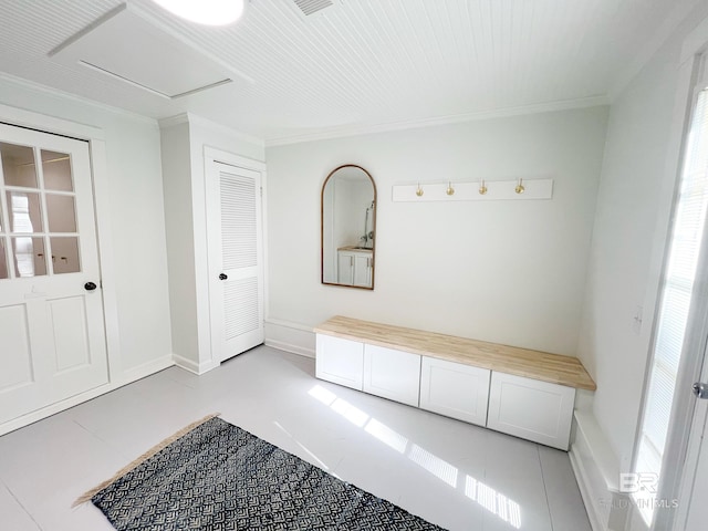 mudroom featuring crown molding and light tile patterned flooring