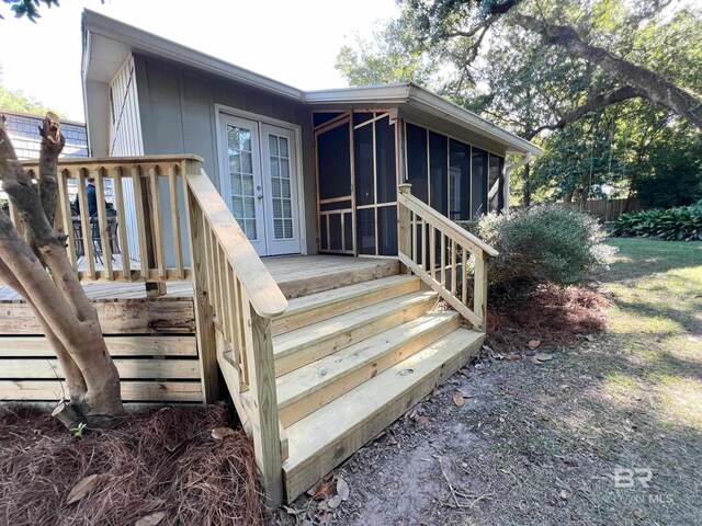 exterior space featuring fence and a deck