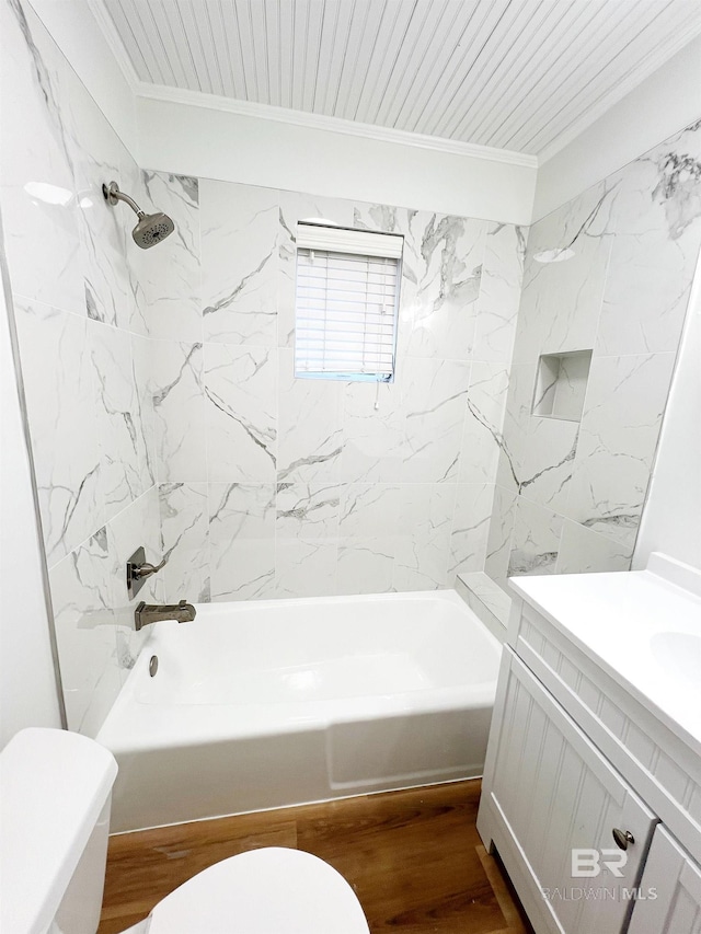 bathroom featuring crown molding, toilet, vanity, and shower / washtub combination