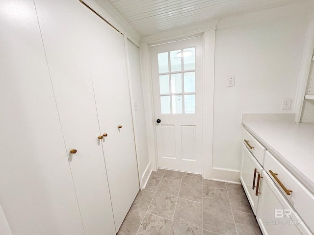 interior space featuring baseboards