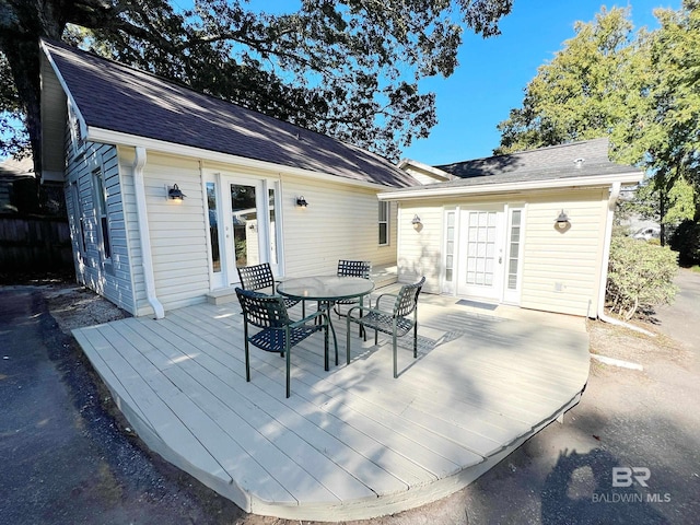 back of property with french doors and a deck