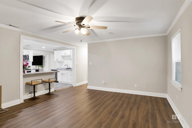 1508 Phillips Ln, Mobile, AL 36618 - unfurnished living room featuring dark wood-style floors, a ceiling fan, baseboards, and ornamental molding