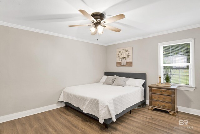 1508 Phillips Ln, Mobile, AL 36618 - bedroom featuring wood finished floors, baseboards, crown molding, and a ceiling fan