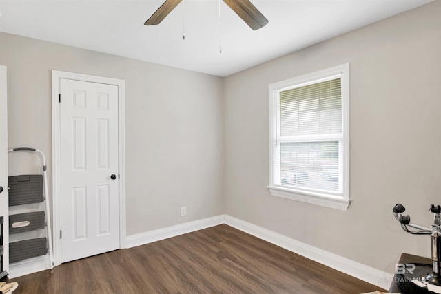 1508 Phillips Ln, Mobile, AL 36618 - unfurnished bedroom with dark wood finished floors, baseboards, and a ceiling fan