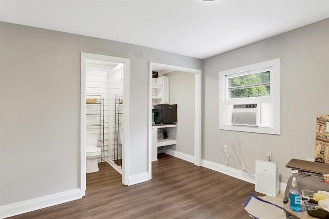1508 Phillips Ln, Mobile, AL 36618 - unfurnished bedroom with dark wood-style floors, baseboards, cooling unit, and ensuite bath