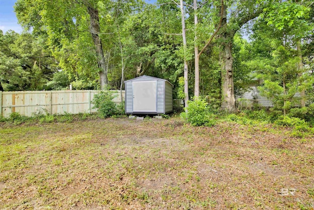 1508 Phillips Ln, Mobile, AL 36618 - view of yard featuring a storage unit, an outbuilding, and fence