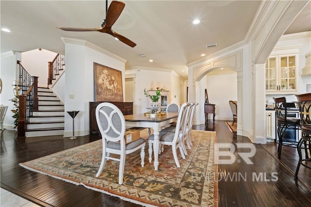 dining space featuring crown molding, ceiling fan, and dark hardwood / wood-style flooring