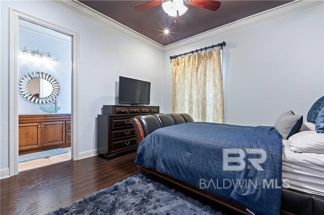 bedroom featuring hardwood / wood-style flooring, ornamental molding, ceiling fan, and ensuite bathroom