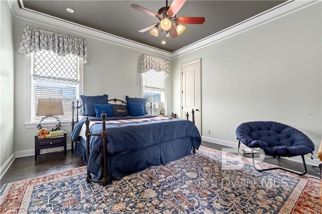 bedroom with ornamental molding, dark hardwood / wood-style floors, and ceiling fan